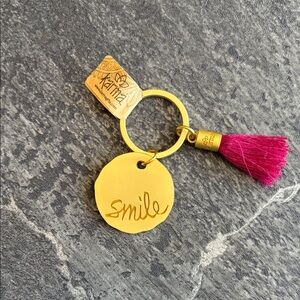 NWT- Karma Gold 'Smile' Keyring with Pink Tassel
